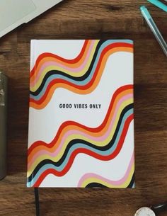 a notebook with the words good vibes only on it