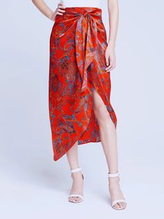 A gorgeous sarong-style midi skirt in pure silk detailed with a fire-red paisley print. Asymetrical sarong panels overlay a front underskirt and tie elegantly at side waist. Flattering smooth elastic waist and no closures. 100% Silk. Sarong Style, Sarong Skirt, Paneled Skirt, Red Paisley, Red Fire, Unique Dresses, Sarong, Bride Bridal, Wedding Bridesmaids