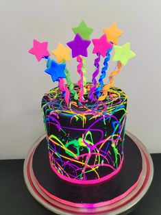 a brightly colored cake with stars on top