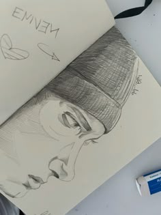 a drawing of a woman's face with a hat on top of her head