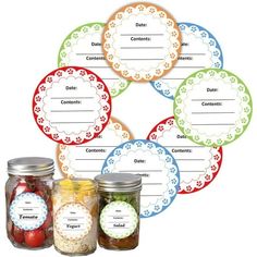 four jars with labels on them sitting in front of each other, all filled with food