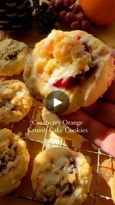 a person holding an orange cranberry orange cookie