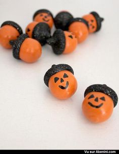 several orange and black pumpkins with faces on them