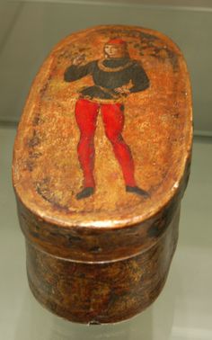 an old wooden box with a painting on it