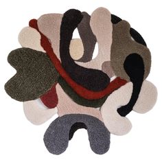 four different colored rugs with leaves on them and one is black, white, gray, red