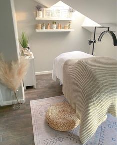 a bedroom with a bed, rug and shelves on the wall above it is shown in an instagram