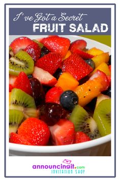 a white bowl filled with fruit salad on top of a table