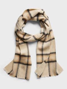 Supremely soft and warm, this wool scarf sports a checked motif that's sure to add an extra pop of visual interest to any outfit.  Length: 76" (193cm) Width: 12" (30. 5cm) Plaid Scarves For Cold Weather In Winter, Classic Plaid Scarves For Fall, Casual Wool Scarves For Fall, Casual Plaid Scarves For Cold Weather, Casual Wool Plaid Scarves, Casual Plaid Wool Scarf, Classic Plaid Scarves For Winter, Scarf Outfit, Beige Plaid