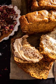 sliced loaf of pumpkin bread with cinnamon butter on top