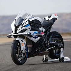 a white and black motorcycle on a race track