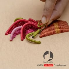 a person is stitching something with scissors