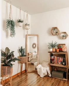 an instagram photo with plants on the wall and other things hanging in front of it