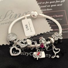 Linx Snake Chain Style Charm Bracelet In 925 Sterling Silver, With A Ball Clasp. The Bracelet Is 3mm In Width And Available In Multiple Lengths. This Bracelet Comes With 7 Linx 925 Sterling Silver Charms. Additional Charms Can Be Added Also. All Of Your Favorite Linx, Pandora, Gnoce, Chamillia And Other Similar Styles Of Charms Will Also Fit This Bracelet. All Items Are New And Come In A Luxury Velvet Jewelry Pouch. *Bracelet And Charms Are Superior Quality! Pandora Me Bracelet, Pandora Bracelet Charms Ideas, Xoxo Jewelry, Bracelet Luxury, Cute Bracelet, Snake Chain Bracelets, Velvet Jewelry, Sterling Silver Charms, Pandora Bracelet Charms