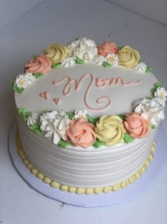 a mother's day cake decorated with flowers