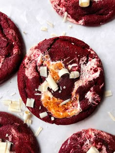 red velvet cookies with white cheese and sprinkles