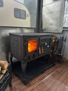 a wood stove sitting in the corner of a room