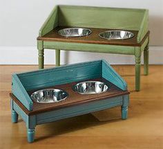 three metal bowls are sitting on top of a wooden table next to a green tray