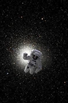 an astronaut floating in the sky with stars around him and his arm extended out to grab something