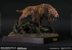 a statue of a cheetah on top of a tree stump with it's mouth open