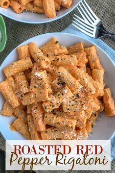 two bowls filled with pasta and sauce on top of a table