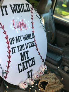 a baseball sign that says it would light up my world if you were my catch at home plate