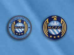 two manchester city badges on a blue shirt