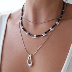 It's a beautiful black crystal beaded choker necklace with unique geometric t-bar bead spacers.  If you're looking for a simple, light and minimal necklace yet elegant and rock this is the best jewelry for you.  Measurements and size: The black crystal beaded necklace is about 15.7 inches long (40cm) plus 5cm stainless steel chain extender. Made from: The necklace is made from 3*3 mm black crystal beads, silver plated zamak ball bead spacers, silver plated zamak t-bar bead spacers, and it's fini Crystal Beaded Necklace, Minimal Necklace, Crystal Bead Necklace, Adjustable Jewelry, Chain Extenders, Beaded Choker Necklace, Jewellery Gift, Metal Casting, Beaded Choker