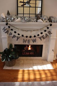 a fireplace with a happy new year banner above it