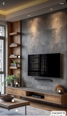 a living room with a large flat screen tv on the wall and shelves in front of it