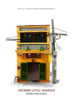 a small yellow building with green shutters on the front and side, next to a telephone pole