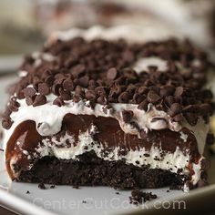 a cake with chocolate chips and white frosting