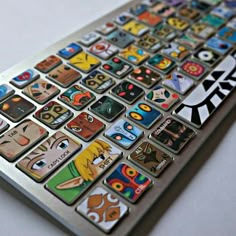 the keyboard has many different stickers on it's back side, including an image of cartoon characters