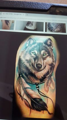 an image of a wolf with feathers on his arm