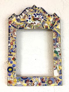 an ornately decorated frame hangs on the wall