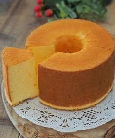 a cake on a plate with one slice cut out