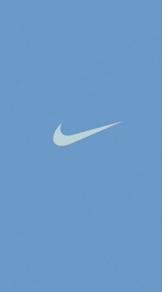 a white nike logo on a blue sky