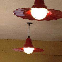 two red lights are hanging from the ceiling