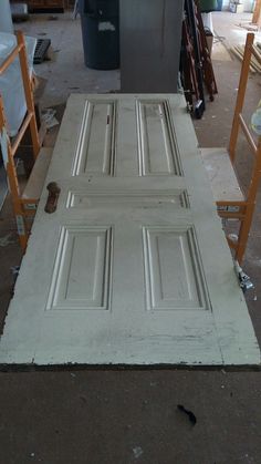 an unfinished door is being worked on in a shop