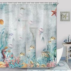 an ocean themed shower curtain with sea animals and starfishs on the water surface