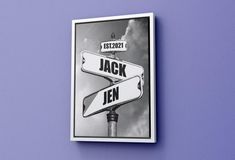 a black and white photo of a street sign with the words jack and jerry on it