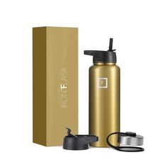 a gold stainless steel water bottle next to a box