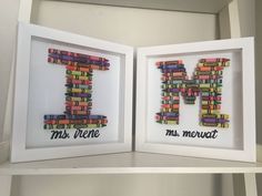 two framed letters that are made out of books