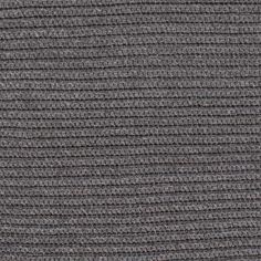 close up view of the texture of a knitted fabric in dark grey color with horizontal stripes