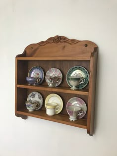 a shelf that has some plates on it