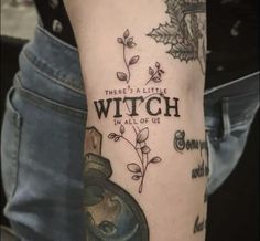 a person with a tattoo on their arm that says, when a little witch hall of us