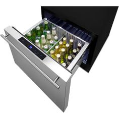 an open refrigerator with beer bottles in it's door and the bottom drawer opened