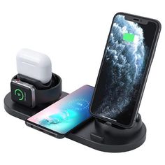 an iphone and charger sitting on top of a charging station with the phone in it's holder