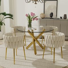 a glass table with chairs around it