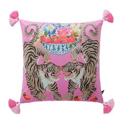 a pink pillow with two tigers on it