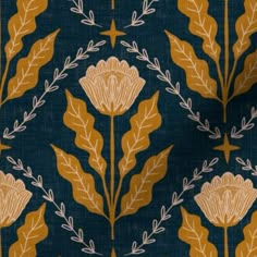 a blue and gold fabric with leaves on it